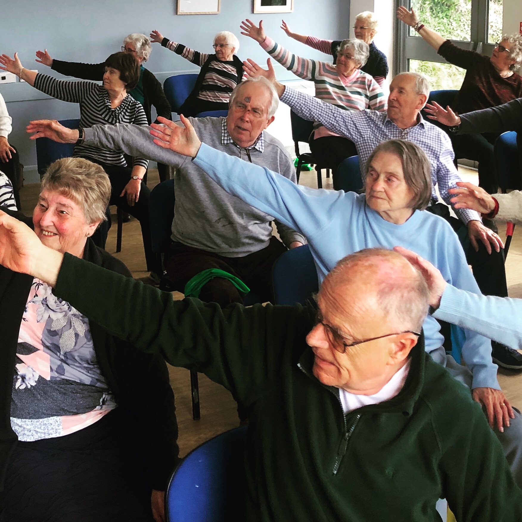 Active Seniors exercising in a community centre