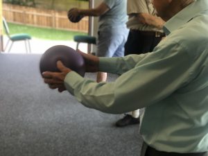 Standing exercise with ball