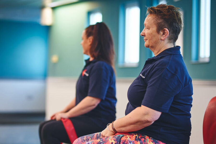 Two seated iCareiMove Falls Prevention instructors leading a class.